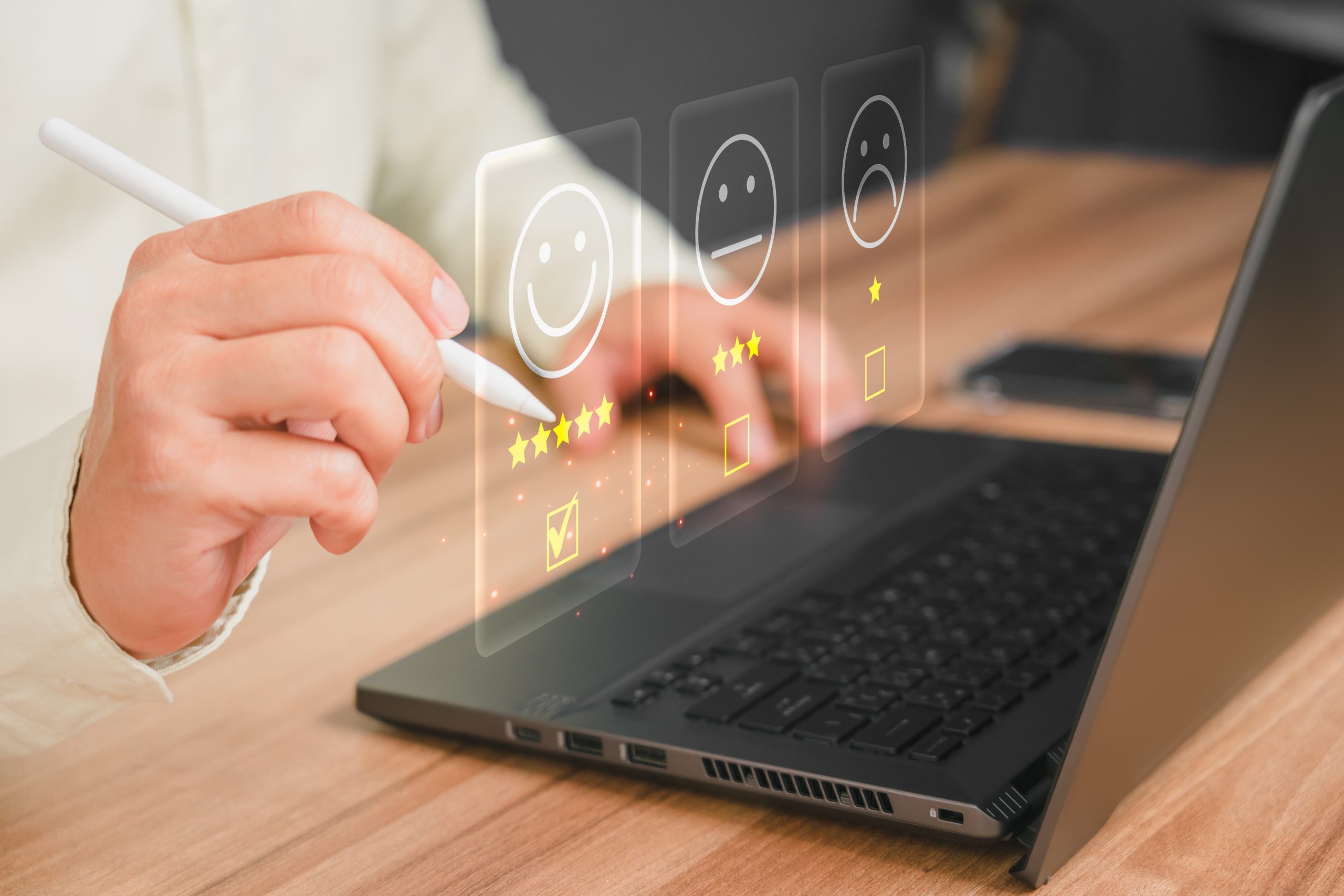 Man,Hand,Using,Computer,Laptop,With,Popup,Five,Star,Icon